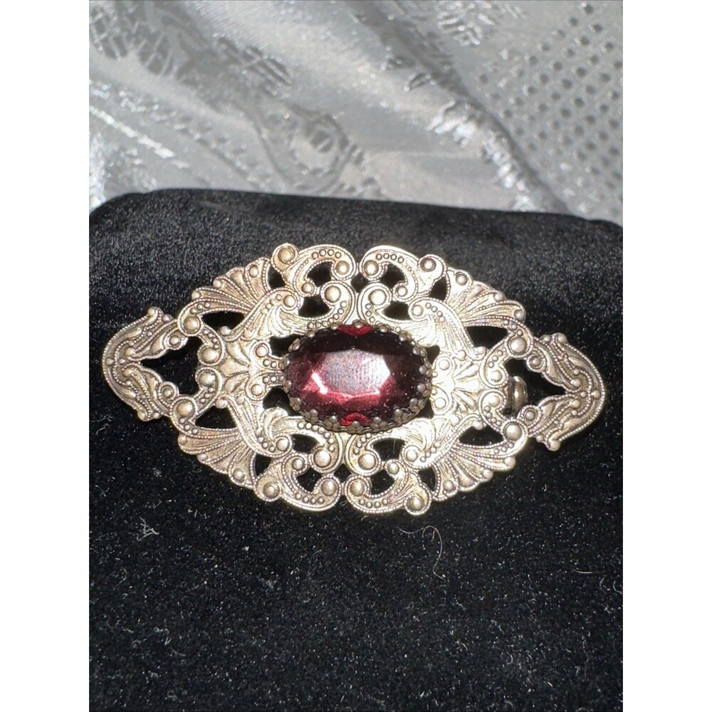 Vintage filigree brooch with rhinestones, Amethyst color